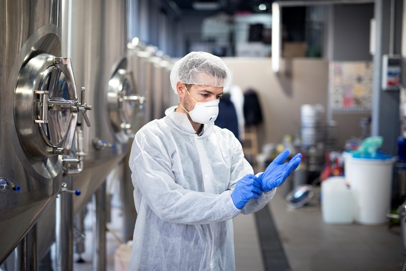 young-technologist-putting-protective-rubber-gloves-production-factory_17078952361471.jpg